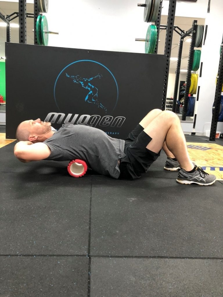 Antony Choice, Director and Soft Tissue Therapist at Myogen, demonstrating foam roller stretch.